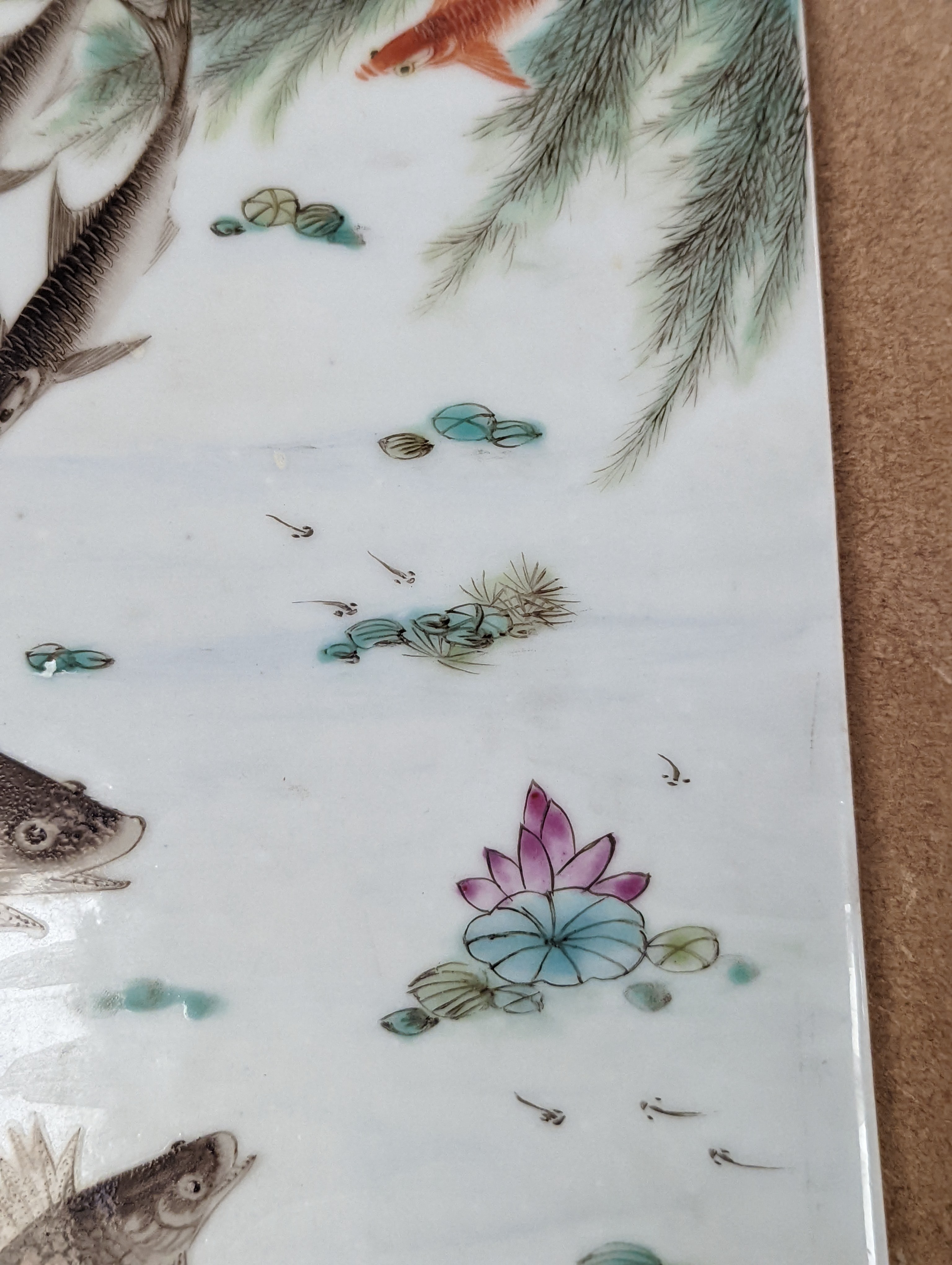 A Chinese famille rose porcelain rectangular plaque, Republic period (1912-49), painted with fish in a pond amid weed and inscribed upper left 36.5x25.5cm